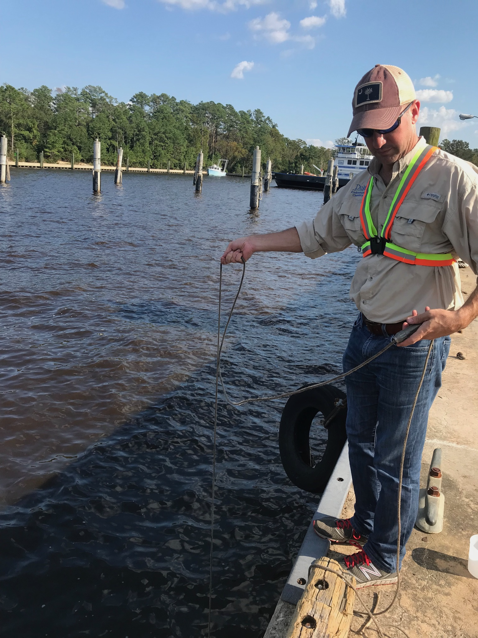 Lee Ferguson samples water after Hurricane Florence in 2018